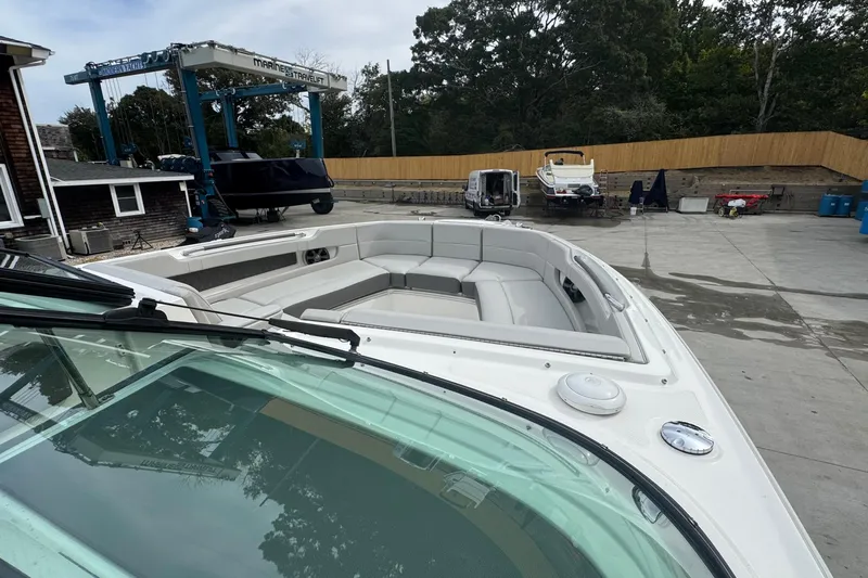  Yacht Photos Pics 2021 Sea Ray 310 SLX boat with spacious seating, docked at a marina.