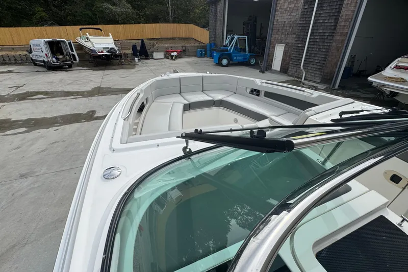  Yacht Photos Pics 2021 Sea Ray 310 SLX boat with spacious seating, parked in a marina.