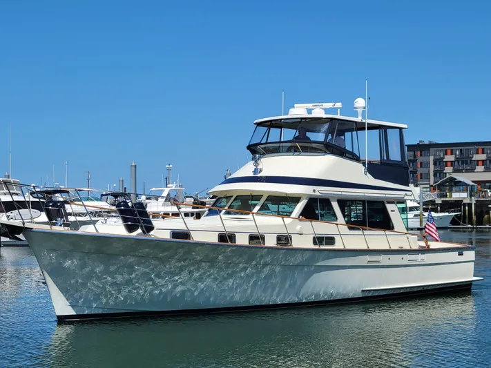 No Agenda Yacht Photos Pics 1982 Tollycraft 48' Sedan yacht docked in a marina under clear blue skies.