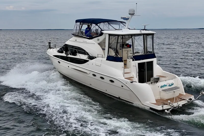 Shake N' Bake Yacht Photos Pics 2006 Meridian Motoryacht cruising on open water, showcasing sleek design and luxury features.