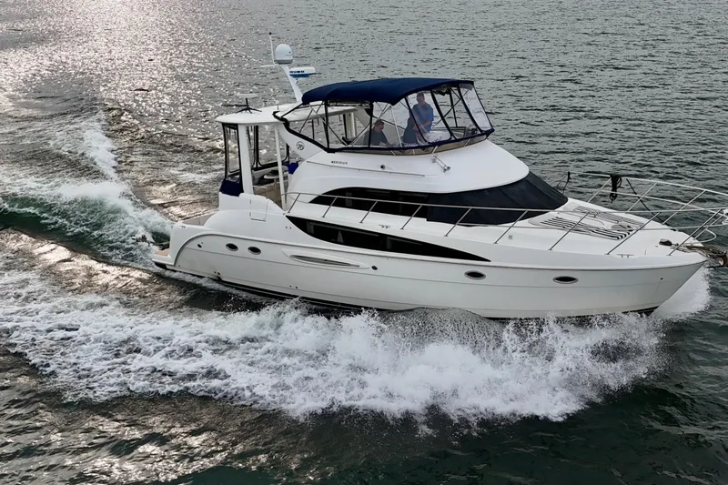 Shake N' Bake Yacht Photos Pics 2006 Meridian Motoryacht cruising on open water, creating waves.