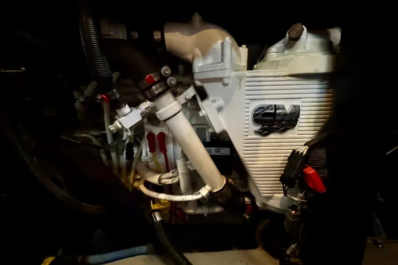 Shake N' Bake Yacht Photos Pics Engine compartment of a 2006 Meridian Motoryacht, showcasing mechanical components and hoses.