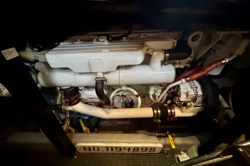 Shake N' Bake Yacht Photos Pics Engine compartment of a 2006 Meridian Motoryacht, showcasing mechanical components and serial number.