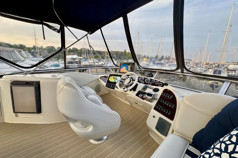 Shake N' Bake Yacht Photos Pics Luxurious 2006 Meridian Motoryacht helm with modern controls and marina view.