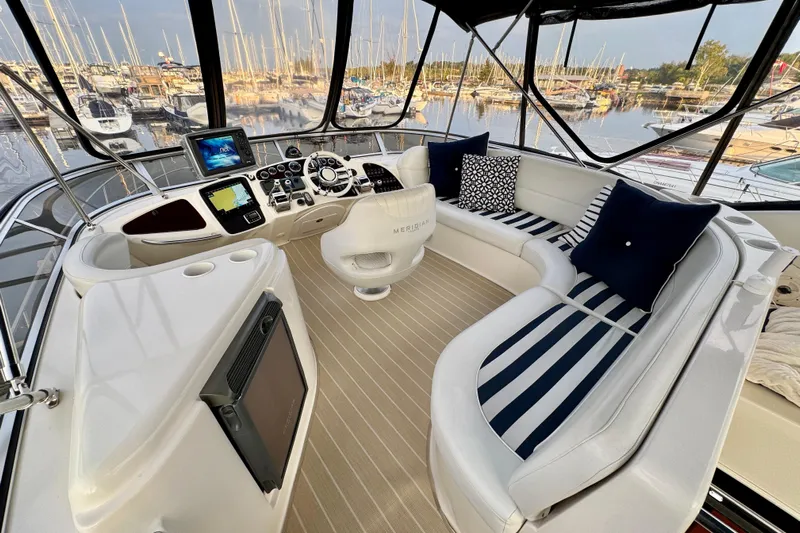 Shake N' Bake Yacht Photos Pics Luxurious 2006 Meridian Motoryacht interior with elegant seating and advanced navigation controls.
