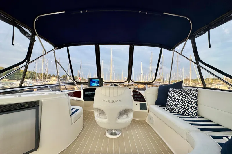 Shake N' Bake Yacht Photos Pics Luxurious 2006 Meridian Motoryacht interior with helm, seating, and marina view.
