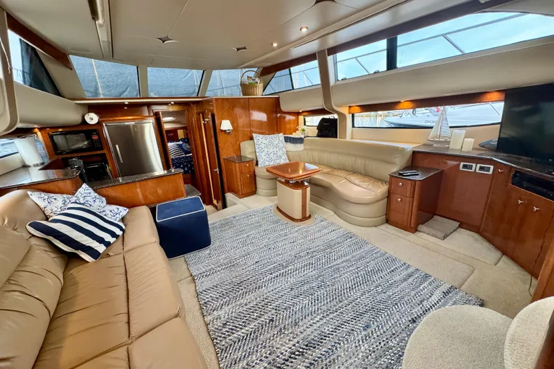 Shake N' Bake Yacht Photos Pics Luxurious 2006 Meridian Motoryacht interior with plush seating, modern kitchen, and elegant decor.