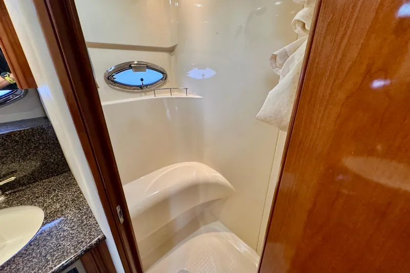 Shake N' Bake Yacht Photos Pics Luxurious bathroom in 2006 Meridian Motoryacht with granite countertop and porthole window.