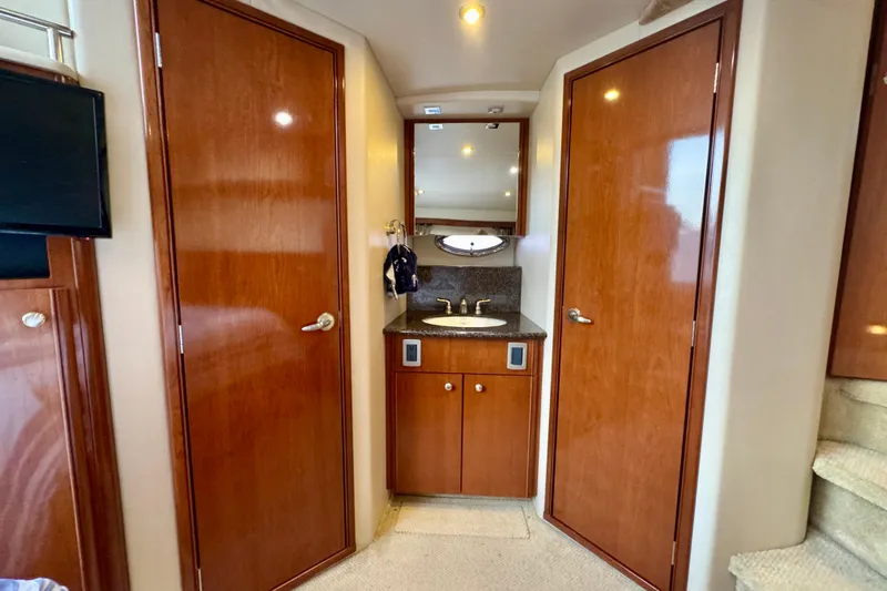 Shake N' Bake Yacht Photos Pics Interior of 2006 Meridian Motoryacht with wooden doors and compact sink area.