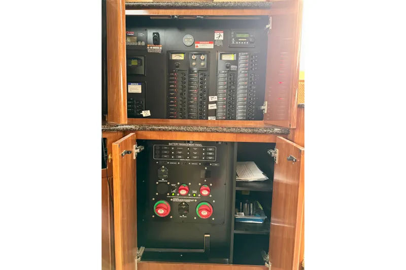 Shake N' Bake Yacht Photos Pics Electrical control panel inside a 2006 Meridian Motoryacht, featuring circuit breakers and battery management.
