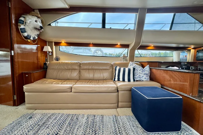 Shake N' Bake Yacht Photos Pics Luxurious 2006 Meridian Motoryacht interior with leather sofa and nautical decor.