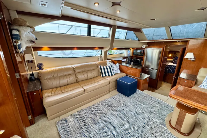 Shake N' Bake Yacht Photos Pics Luxurious 2006 Meridian Motoryacht interior with leather seating, modern kitchen, and elegant decor.