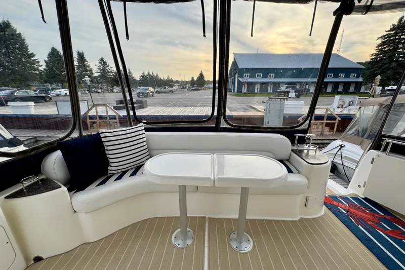 Shake N' Bake Yacht Photos Pics 2006 Meridian Motoryacht interior with seating area, table, and marina view.
