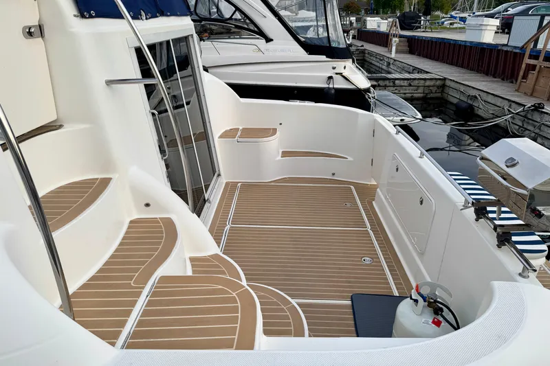 Shake N' Bake Yacht Photos Pics 2006 Meridian Motoryacht deck with teak flooring and marina view.