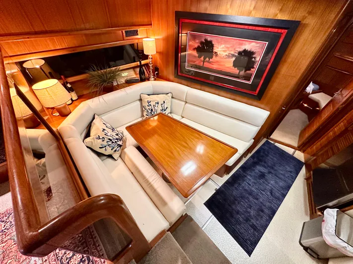Sea Suite Yacht Photos Pics Luxurious interior of 1989 Viking 44 Motor Yacht with elegant dining area and artwork.
