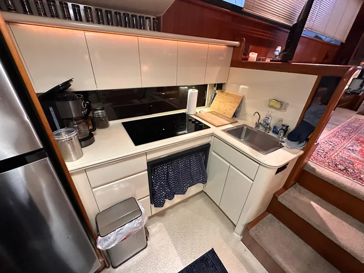 Sea Suite Yacht Photos Pics 1989 Viking 44 Motor Yacht kitchen with modern appliances and compact design.