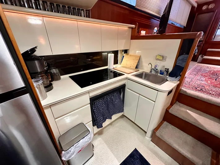 Sea Suite Yacht Photos Pics 1989 Viking 44 Motor Yacht kitchen with modern appliances and sleek cabinetry.