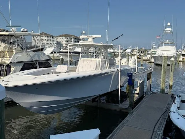 Finns Up Yacht Photos Pics 2024 SeaVee Open Fisherman 390Z docked in a marina, surrounded by other boats.