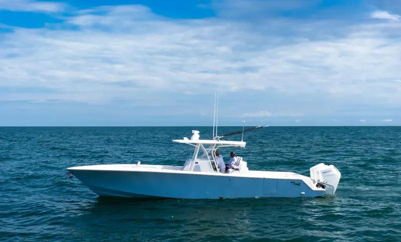 Finns Up Yacht Photos Pics 2024 SeaVee Open Fisherman 390Z boat cruising on open ocean waters.