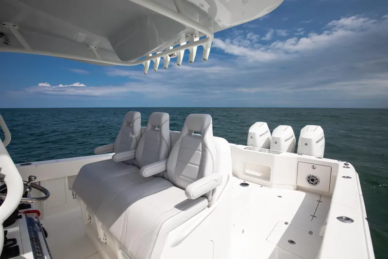 Finns Up Yacht Photos Pics 2024 SeaVee Open Fisherman 390Z boat with triple engines, spacious seating, and ocean view.