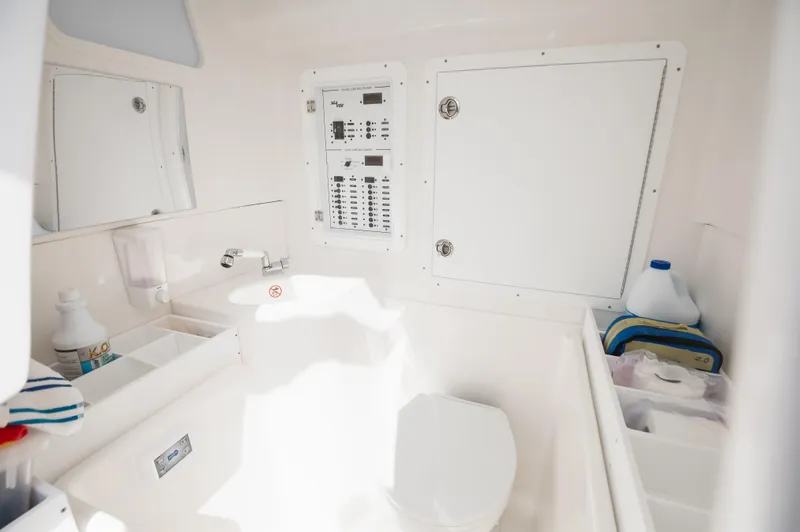 Finns Up Yacht Photos Pics 2024 SeaVee Open Fisherman 390Z interior bathroom with toilet, sink, and storage compartments.