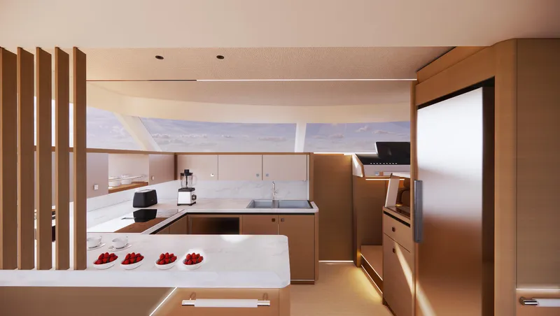 Clinique Bateau Yacht Photos Pics Modern yacht kitchen interior with sleek design, featuring marble countertops and wooden cabinetry. YOT 53, 2025.
