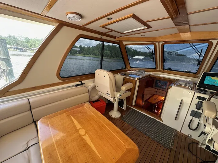 True Blue Yacht Photos Pics Interior of 2005 Sabre 42 Express yacht with wood accents and panoramic windows.