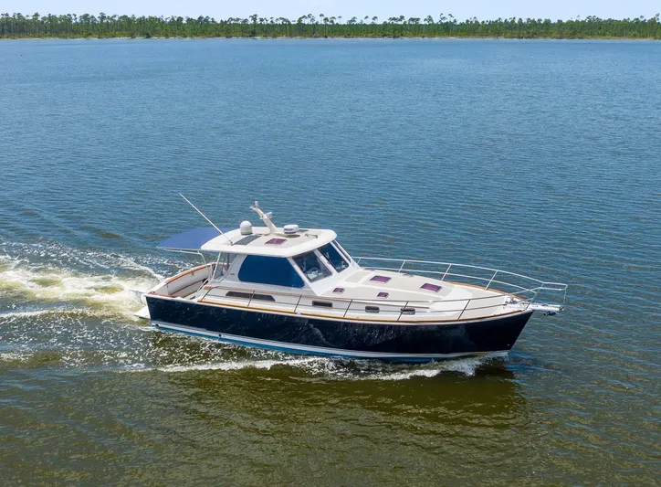 True Blue Yacht Photos Pics 2005 Sabre 42 Express yacht cruising on open water.