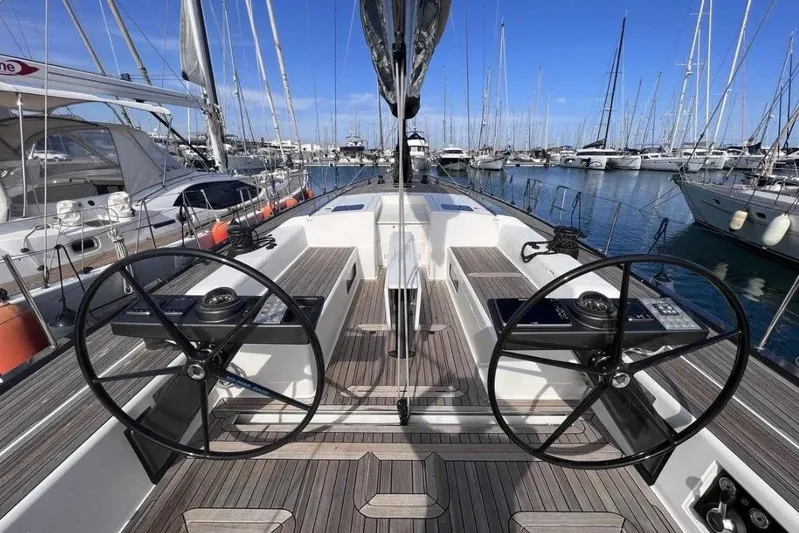 SueÑo Yacht Photos Pics Luxury 2016 Ice Yachts 62 sailboat with dual steering wheels in a marina setting.