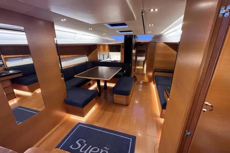 SueÑo Yacht Photos Pics Luxurious interior of 2016 Ice Yachts 62, featuring elegant wood finishes and modern seating.
