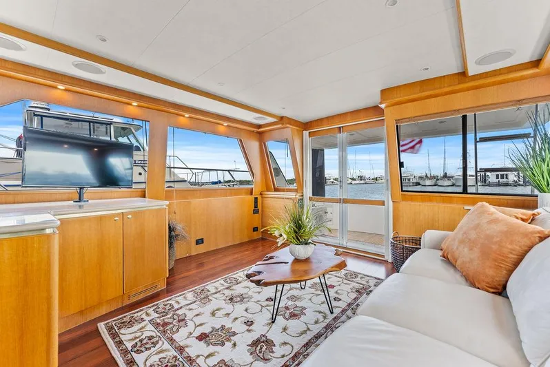 Five O'clock Yacht Photos Pics Luxurious interior of 2000 West Bay 58 Sonship yacht with elegant furnishings and large windows.