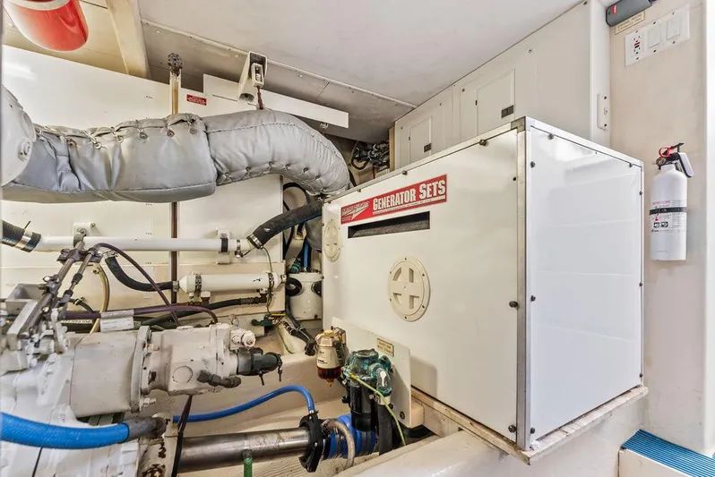 Five O'clock Yacht Photos Pics Engine room of 2000 West Bay 58 Sonship yacht with generator and machinery.