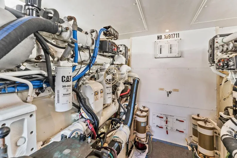 Five O'clock Yacht Photos Pics Engine room of 2000 West Bay 58 Sonship yacht, featuring CAT machinery and equipment.