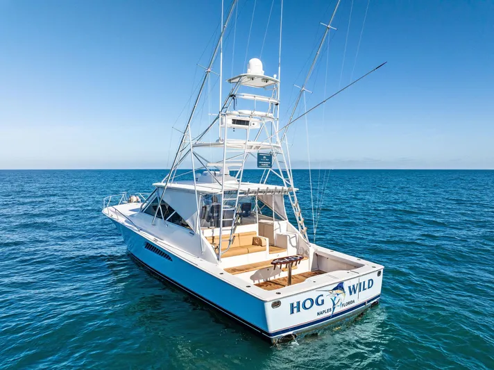 Hog Wild Yacht Photos Pics 2007 Viking 52 Open yacht on open sea, clear blue sky.