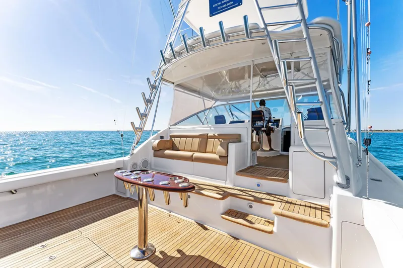 Hog Wild Yacht Photos Pics 2007 Viking 52 Open yacht with spacious deck and seating, cruising on clear blue waters.