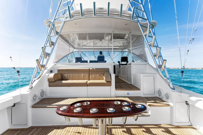 Hog Wild Yacht Photos Pics 2007 Viking 52 Open yacht interior with seating and fishing setup on a sunny day.