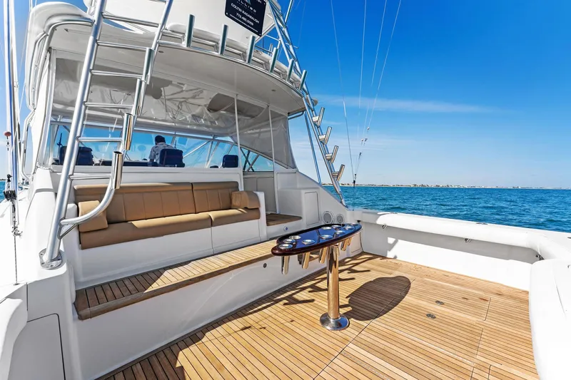 Hog Wild Yacht Photos Pics 2007 Viking 52 Open yacht with spacious deck and seating, cruising on a sunny day.