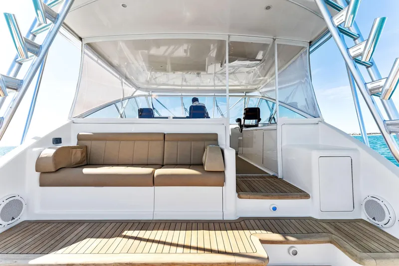 Hog Wild Yacht Photos Pics 2007 Viking 52 Open yacht interior with seating and helm, showcasing luxury marine design.