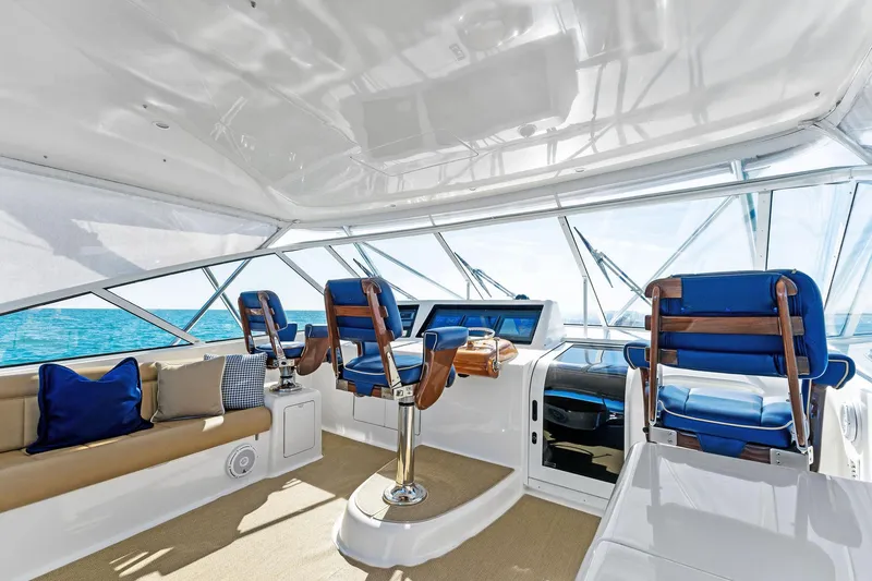 Hog Wild Yacht Photos Pics Luxurious interior of 2007 Viking 52 Open yacht with plush seating and ocean view.