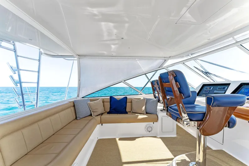 Hog Wild Yacht Photos Pics Interior of 2007 Viking 52 Open yacht with seating and helm, ocean view.