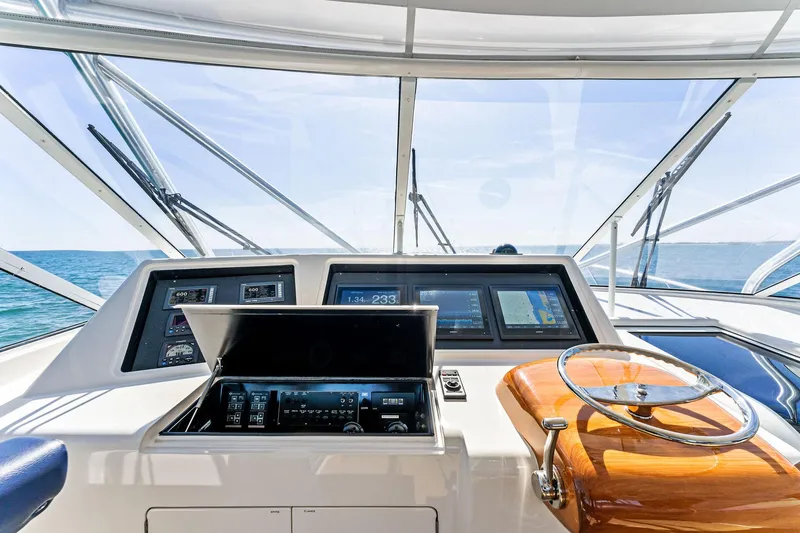 Hog Wild Yacht Photos Pics 2007 Viking 52 Open yacht helm with modern navigation equipment and ocean view.