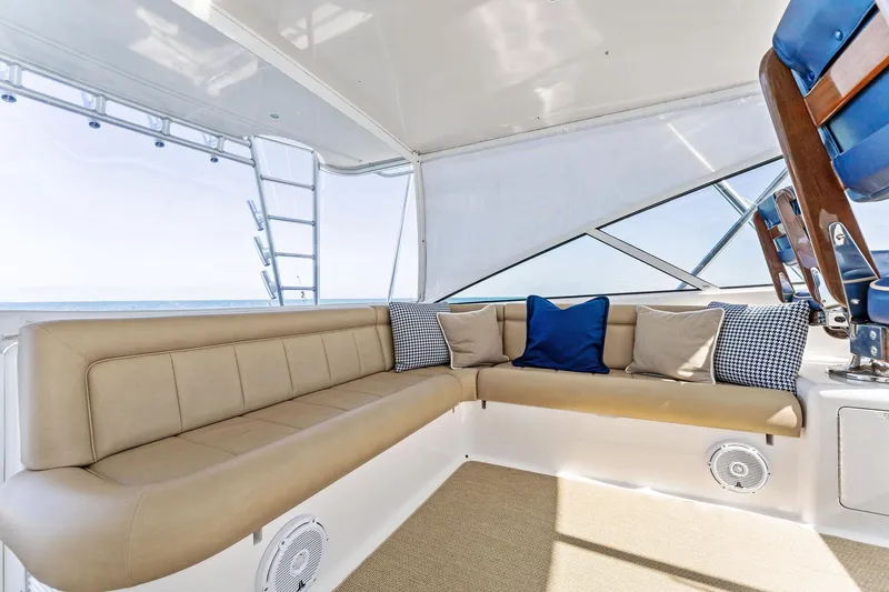 Hog Wild Yacht Photos Pics Luxurious seating area on a 2007 Viking 52 Open yacht with cushions and ocean view.