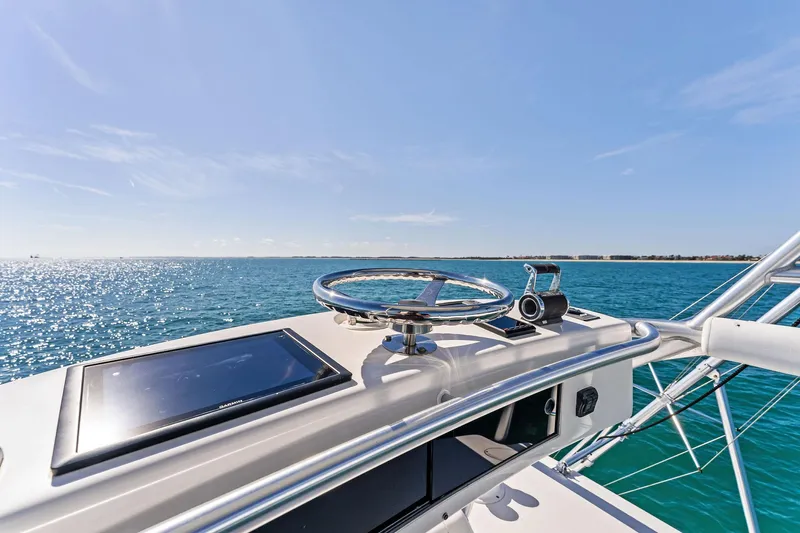 Hog Wild Yacht Photos Pics 2007 Viking 52 Open yacht helm with ocean view under clear blue sky.