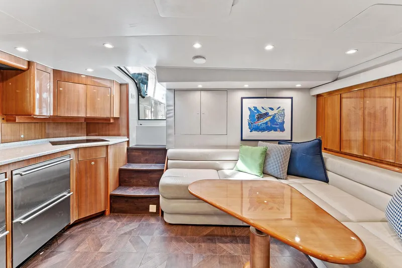 Hog Wild Yacht Photos Pics Luxurious interior of 2007 Viking 52 Open yacht with modern kitchen and seating area.