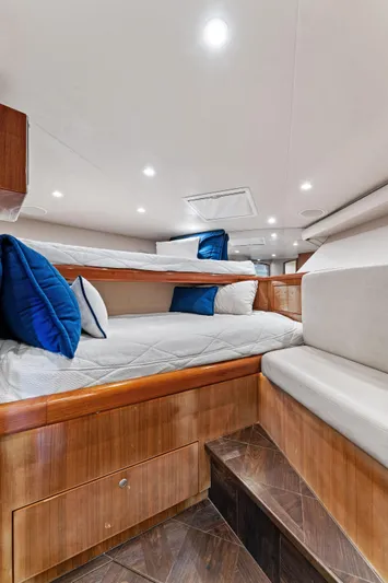 Hog Wild Yacht Photos Pics 2007 Viking 52 Open yacht interior with cozy bunk beds and elegant wood finish.