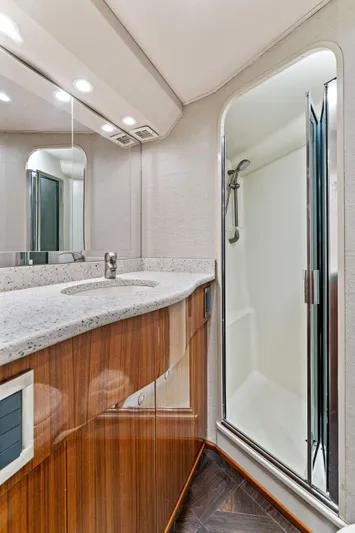 Hog Wild Yacht Photos Pics 2007 Viking 52 Open yacht bathroom with modern sink and enclosed shower.