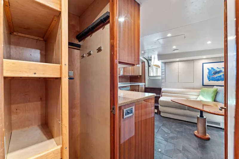 Hog Wild Yacht Photos Pics Interior of 2007 Viking 52 Open yacht with wood cabinetry and cozy seating area.