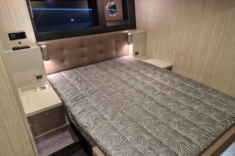 Cranchi St 60 2023 Yacht Photos Pics Luxurious bedroom interior of 2023 Cranchi 60 ST yacht with modern design and elegant bedding.