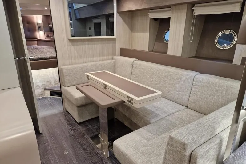 Cranchi St 60 2023 Yacht Photos Pics Luxurious interior of 2023 Cranchi 60 ST yacht with elegant seating and modern decor.