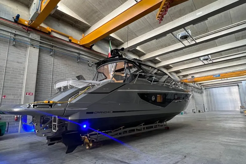 Cranchi St 60 2023 Yacht Photos Pics 2023 Cranchi 60 ST yacht in a modern indoor facility.
